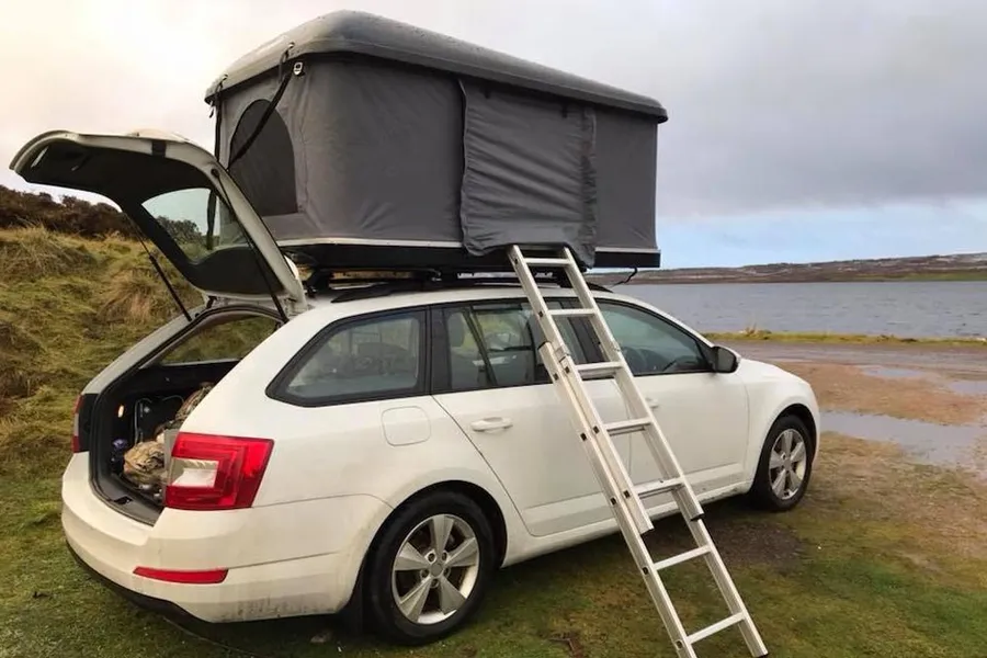 Rooftop tent beside water