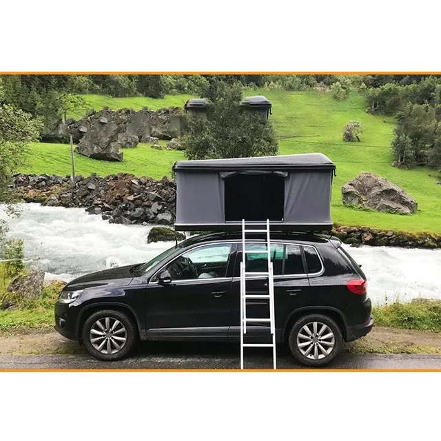 Rooftop tent beside river